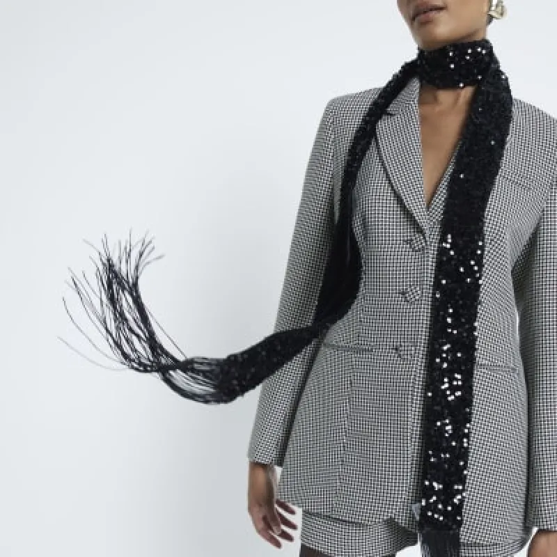 Black sequin skinny scarf sold by River Island
