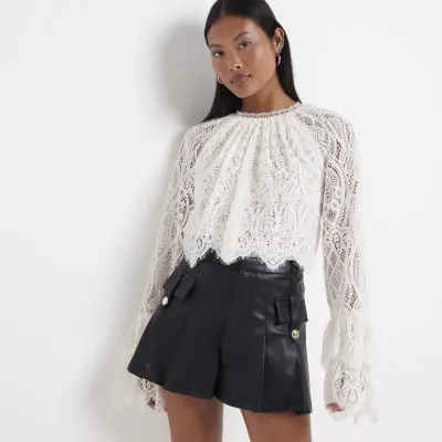 Petite black Faux Leather military shorts sold by River Island