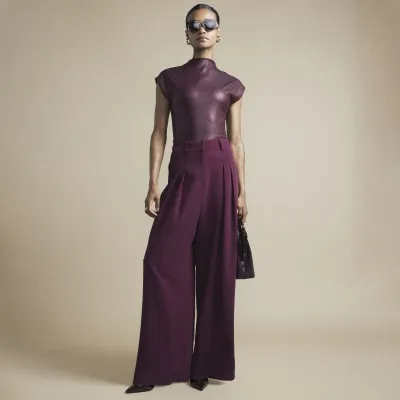 Red coated high neck top sold by River Island