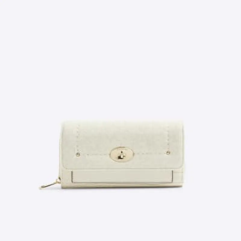 Cream croc embossed purse sold by River Island