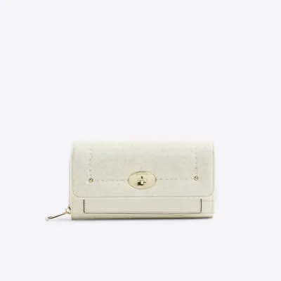 Cream croc embossed purse sold by River Island