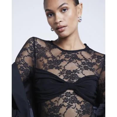 Black lace tie back bodysuit sold by River Island