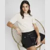 Cream knit button detail t-shirt sold by River Island