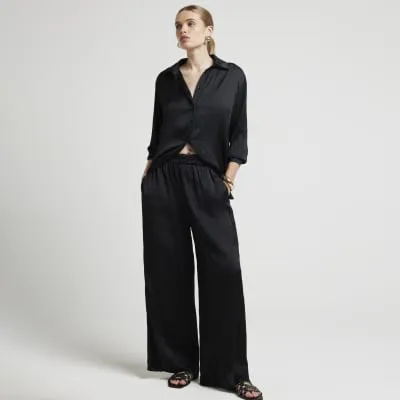 Black crinkle satin shirt sold by River Island