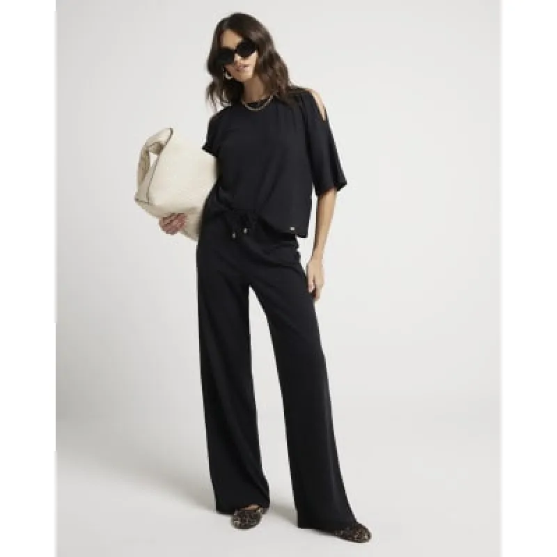 Black textured wide leg trousers sold by River Island