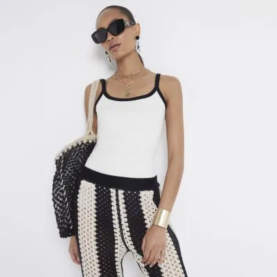 White ribbed tipped vest top sold by River Island