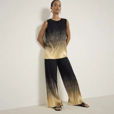 Black plisse ombre wide leg trousers sold by River Island