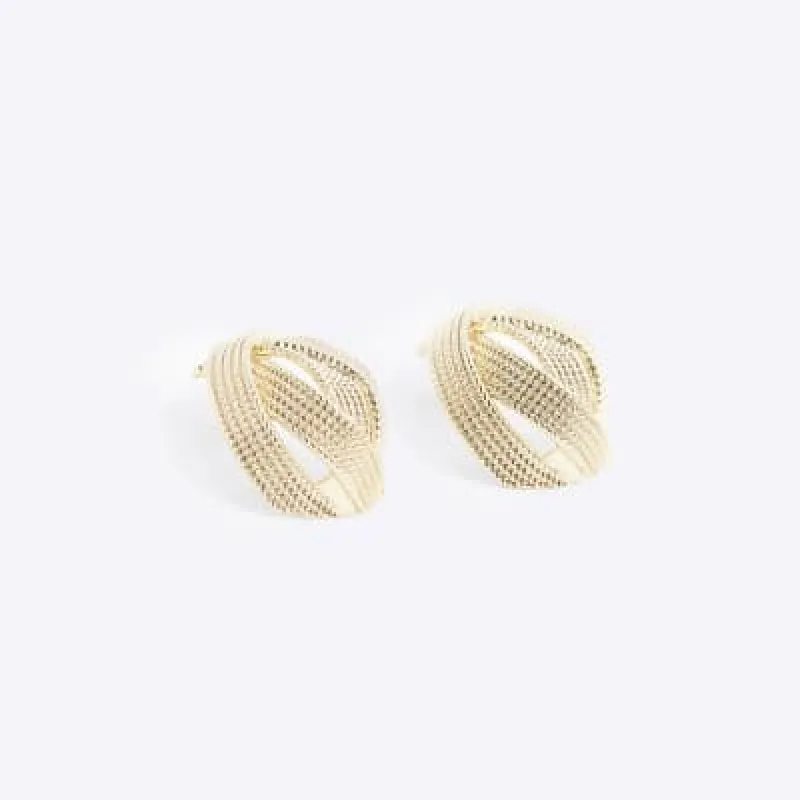 Gold textured cross over earrings sold by River Island
