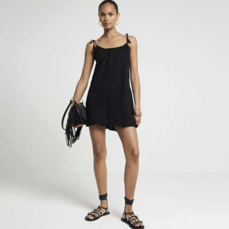 Black crochet frill playsuit sold by River Island