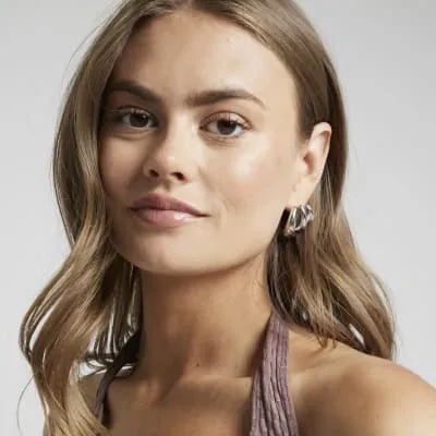 Silver multirow domed earrings sold by River Island