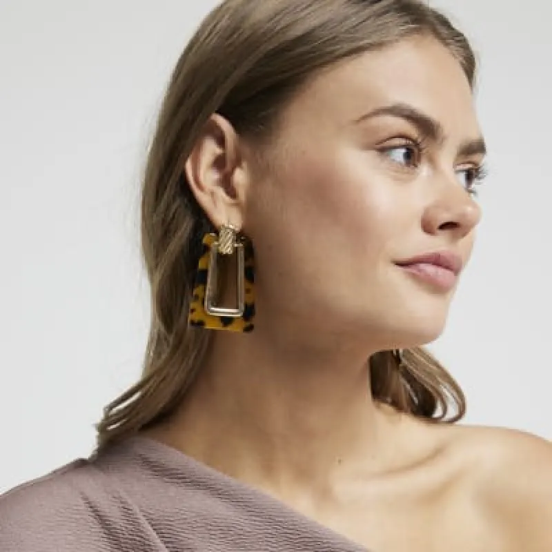 Gold tortoiseshell drop earrings sold by River Island