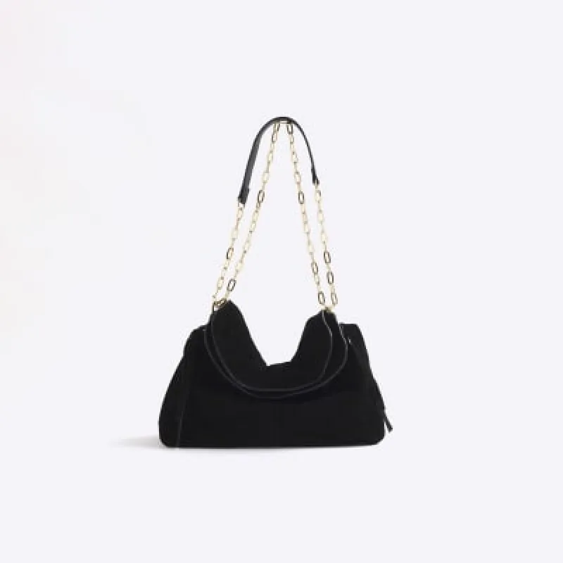 Black souchy suede shoulder bag sold by River Island