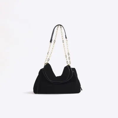 Black souchy suede shoulder bag sold by River Island