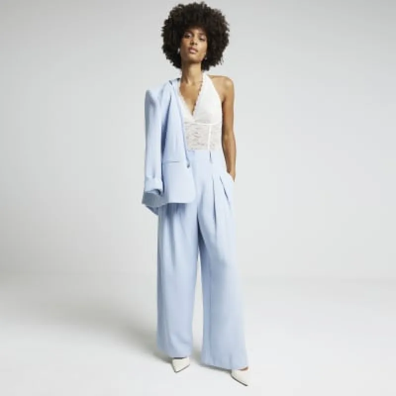 Blue wide leg trousers sold by River Island