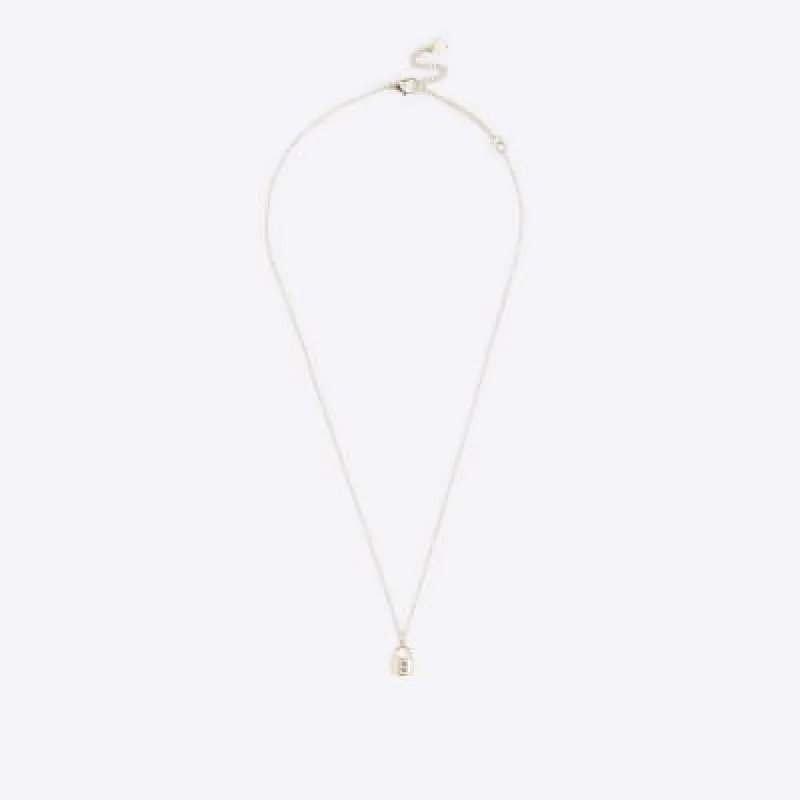 Gold E initial lock necklace sold by River Island