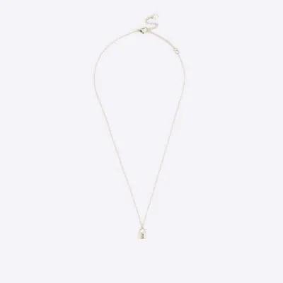Gold E initial lock necklace sold by River Island