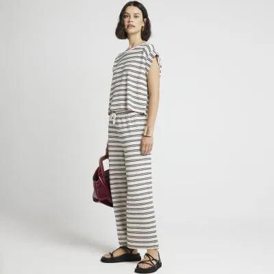 Cream crochet stripe wide leg trousers sold by River Island