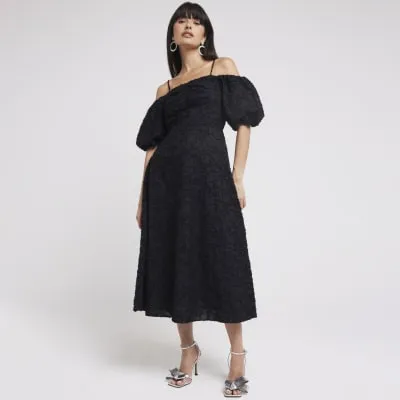 Black puff sleeve skater midi dress sold by River Island