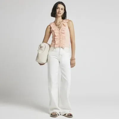 Pink ruffle detail ribbed tank top sold by River Island