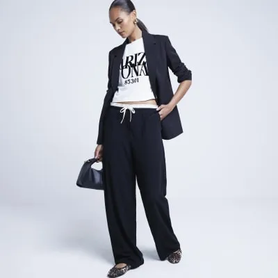 Black double waist wide leg trousers sold by River Island
