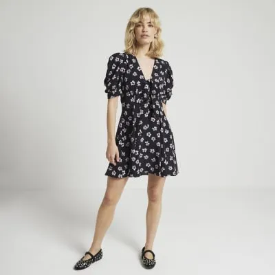 Black floral tie front swing mini dress sold by River Island