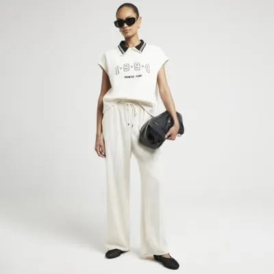 Cream wide leg jogger trousers sold by River Island