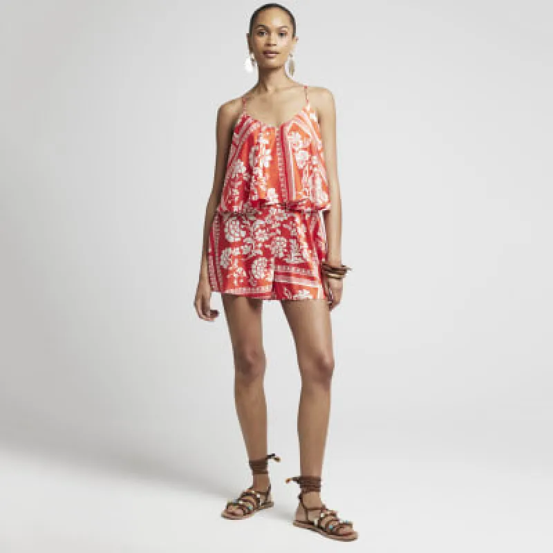 Red floral cami playsuit sold by River Island