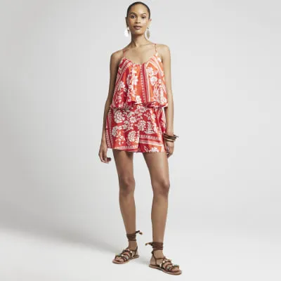 Red floral cami playsuit sold by River Island