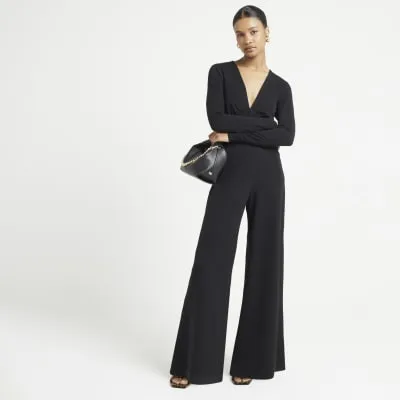Black plunge wide leg jumpsuit sold by River Island
