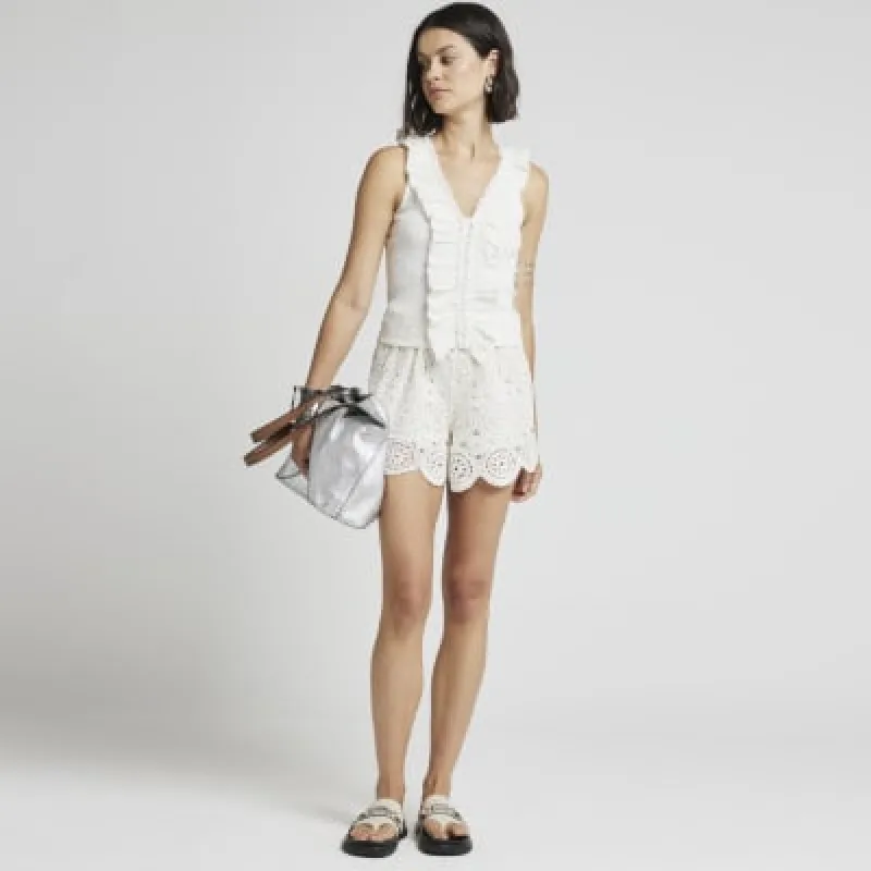 Cream ruffle detail ribbed tank top sold by River Island