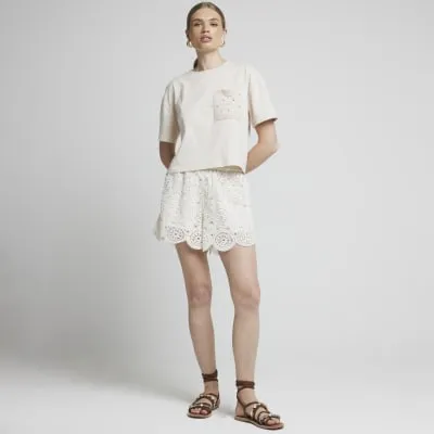 Beige crochet pocket t-shirt sold by River Island