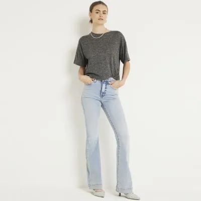 Blue high waisted flared jeans sold by River Island