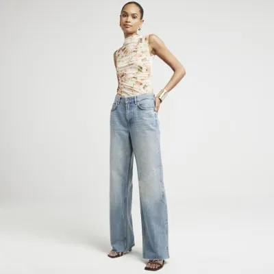 Orange mesh floral vest top sold by River Island