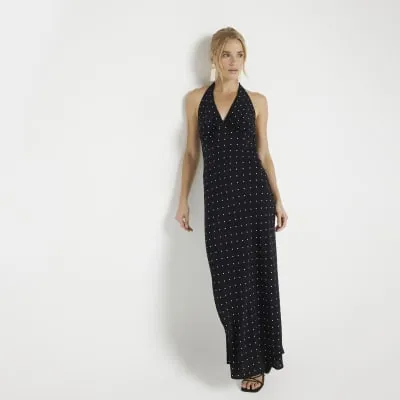 Black spot halter neck slip maxi dress sold by River Island