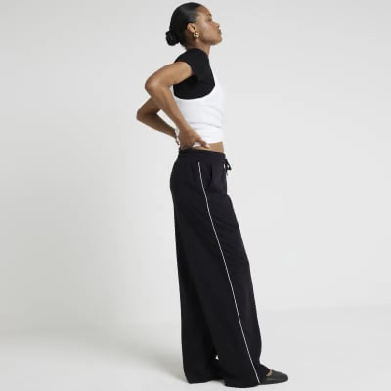 Black side stripe wide leg joggers sold by River Island