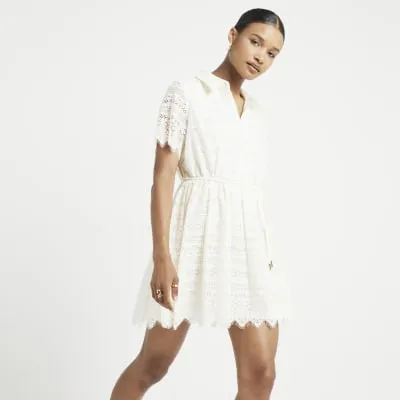 Cream lace belted mini shirt dress sold by River Island