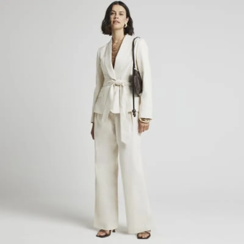 Cream belted linen blend wide leg trousers sold by River Island