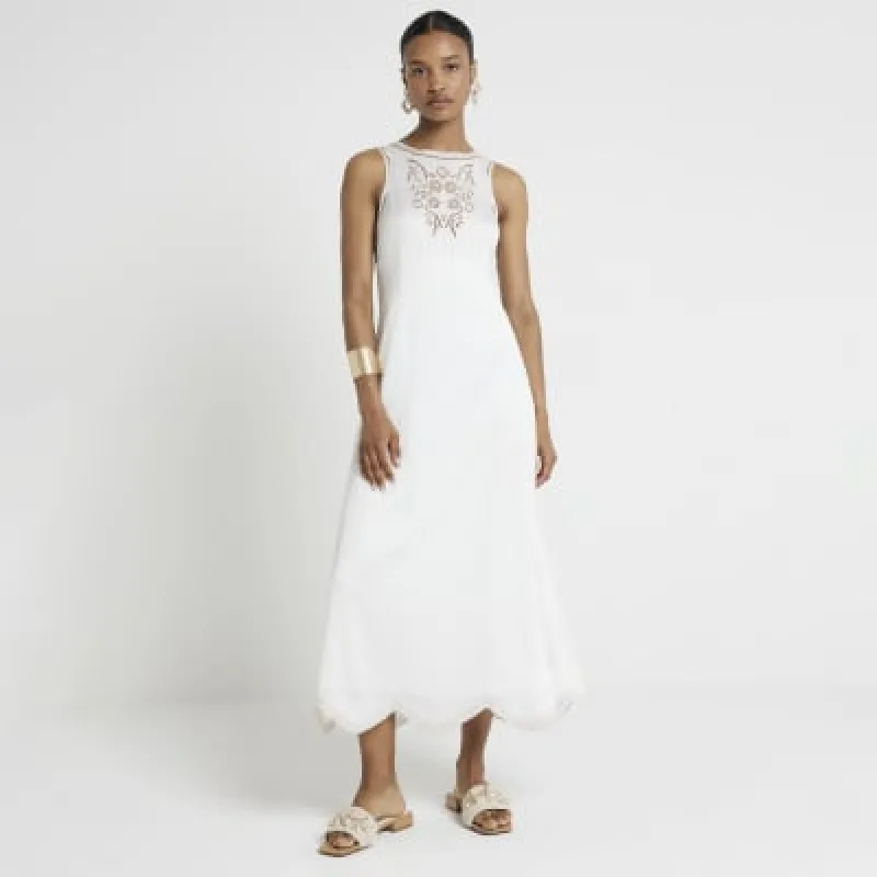 White broderie slip midi dress sold by River Island