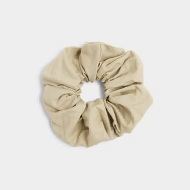 Brown linen hair scrunchie sold by River Island