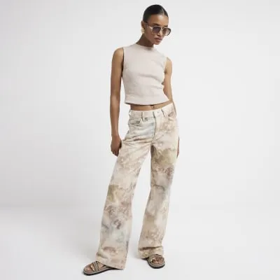 Beige ribbed high neck tank top sold by River Island