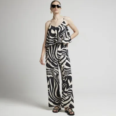 Black animal print Jumpsuit sold by River Island