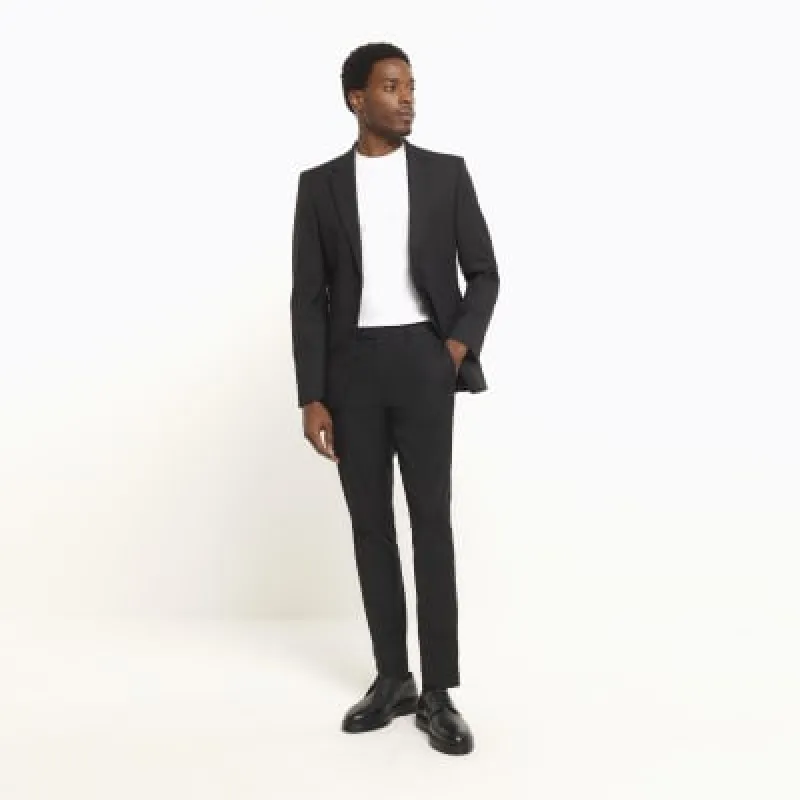 Black skinny fit twill suit trousers sold by River Island