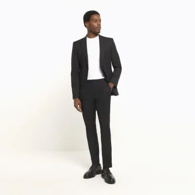 Black skinny fit twill suit trousers sold by River Island