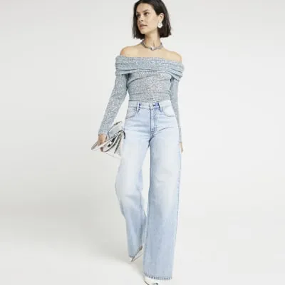 Blue sequin off the shoulder top sold by River Island