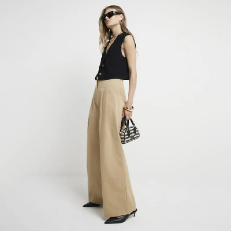 Beige high waisted wide leg trousers sold by River Island