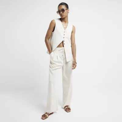 Cream wide leg stripe trousers sold by River Island