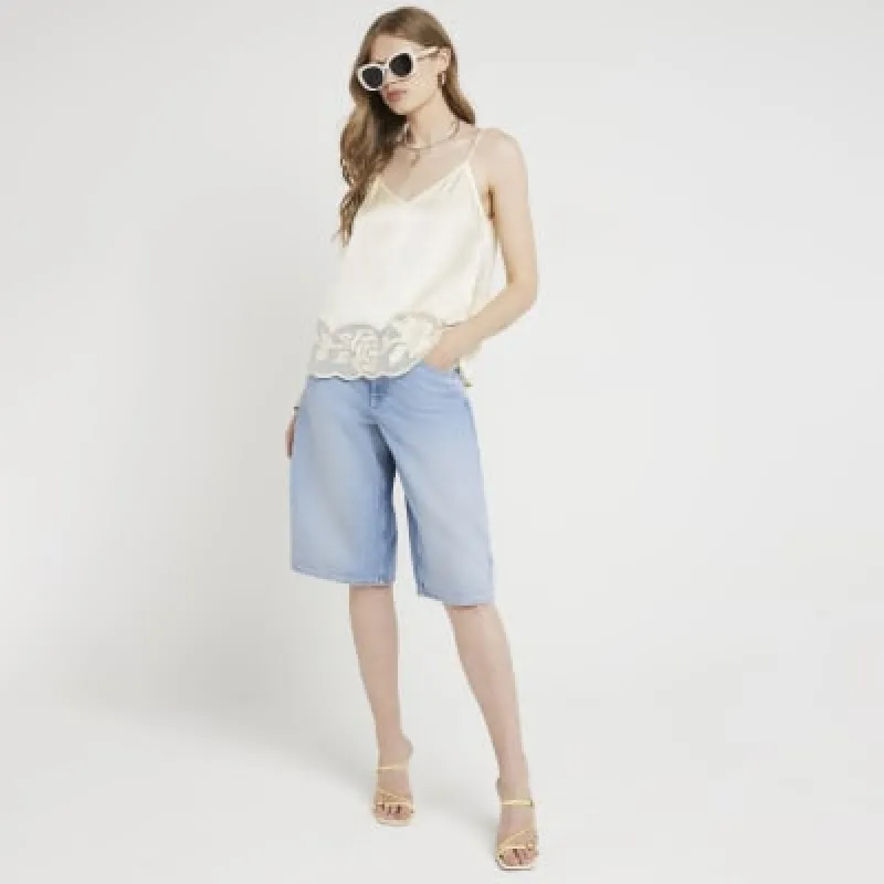Yellow satin lace hem cami top sold by River Island