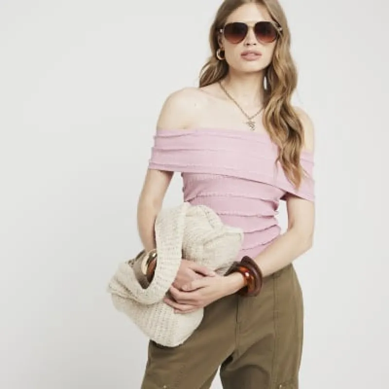 Pink textured bardot top sold by River Island