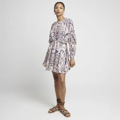 Pink floral elasticated swing mini dress sold by River Island