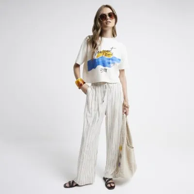 Cream graphic print boxy t-shirt sold by River Island